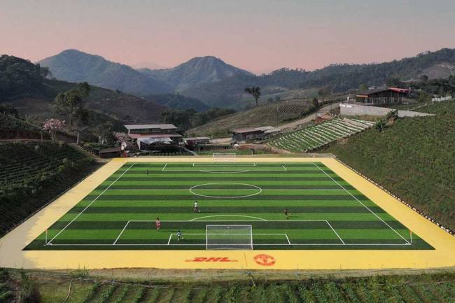 DHL and Manchester United deliver professional football pitch in Thailand