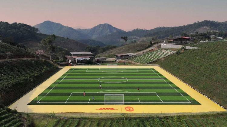 DHL and Manchester United deliver professional football pitch in Thailand